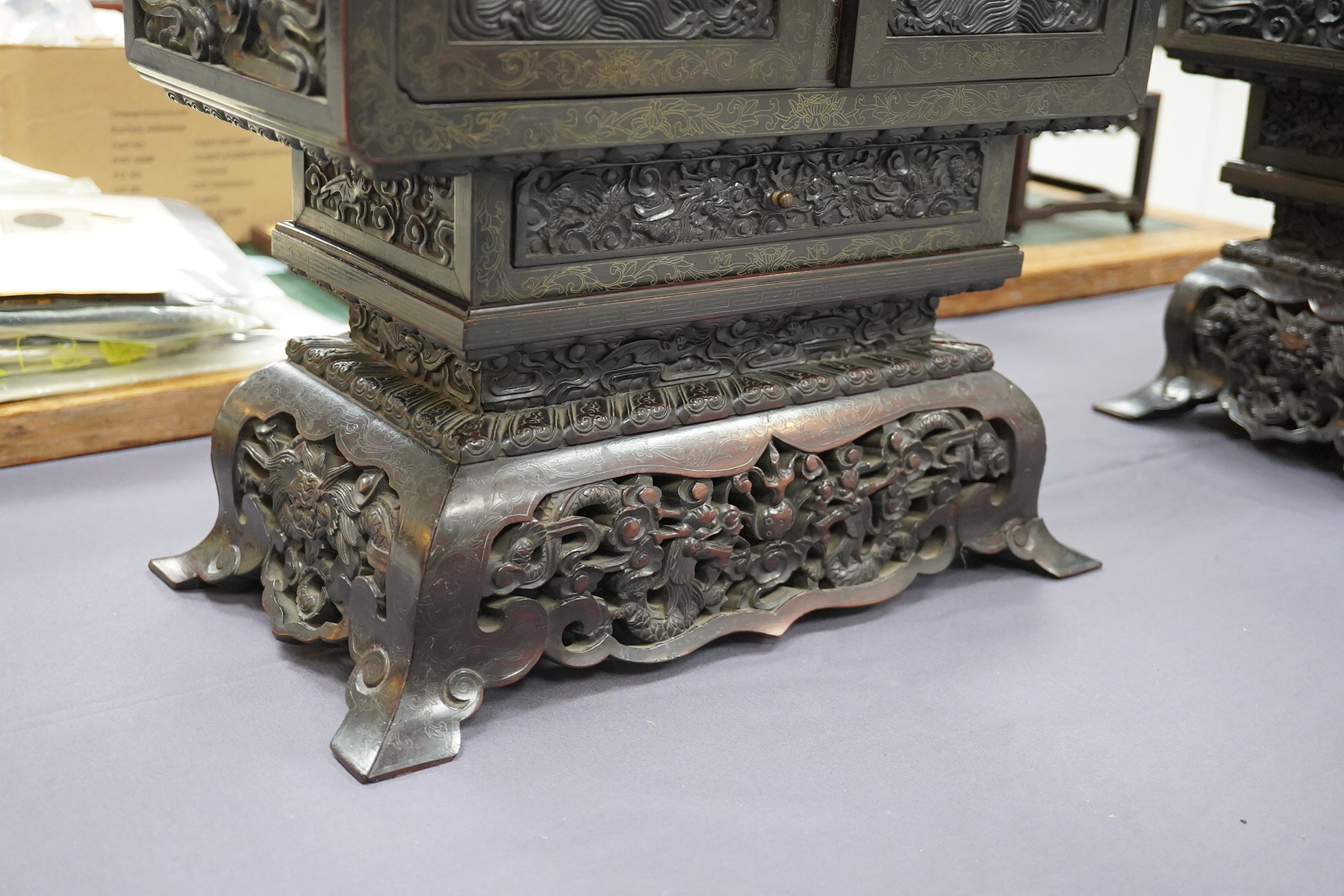 An important pair of Chinese carved zitan and silver wire inlaid ‘cloud and dragon’ curio cabinets and stands, duobaoge, probably Imperial, late Qing dynasty